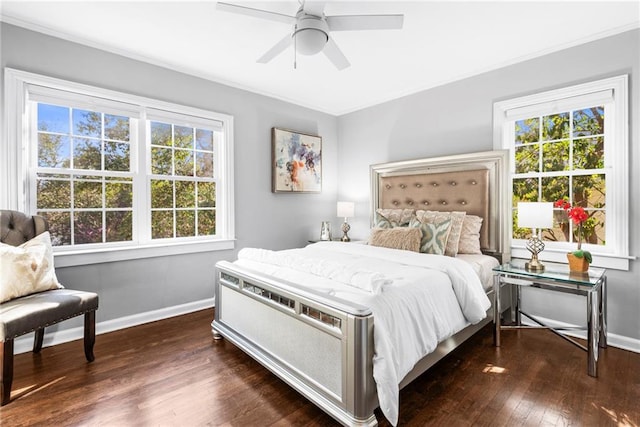 bedroom with a ceiling fan, crown molding, baseboards, and dark wood-style flooring