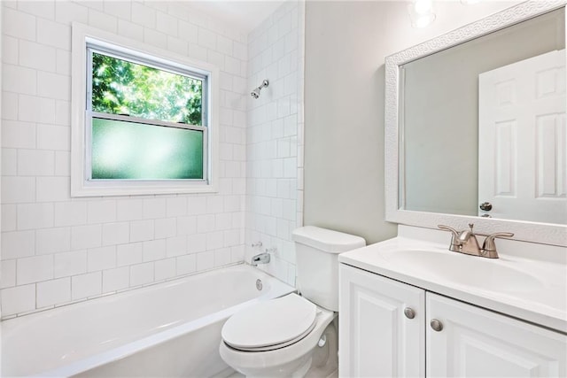 bathroom with tub / shower combination, toilet, and vanity