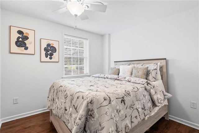 bedroom with a ceiling fan, wood finished floors, and baseboards