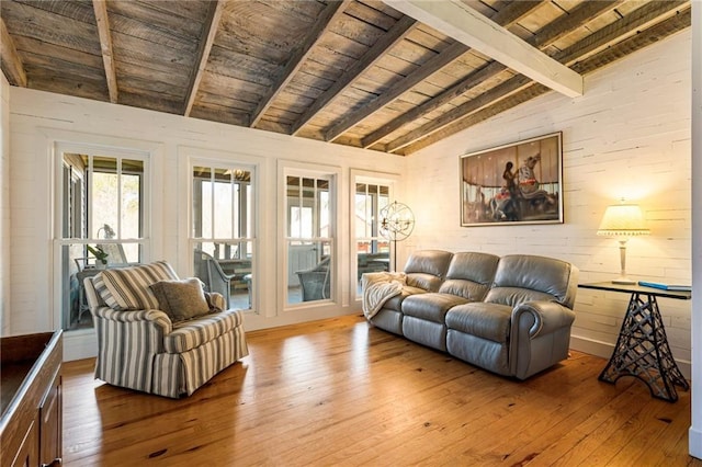 living room featuring wooden ceiling, wood walls, lofted ceiling with beams, and hardwood / wood-style flooring