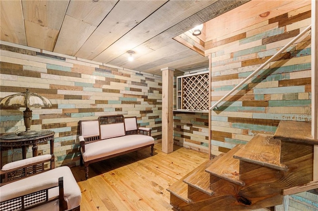 wine area featuring wood finished floors, wood ceiling, and wooden walls