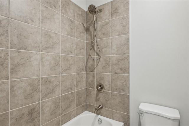 bathroom featuring toilet and washtub / shower combination