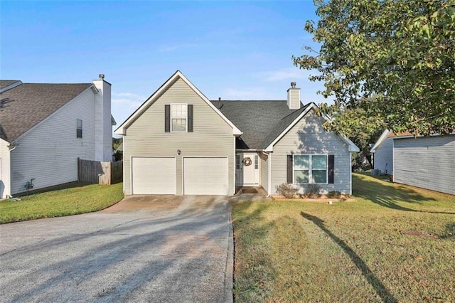 view of front facade with a front yard and a garage