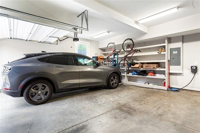 garage featuring a garage door opener and electric panel