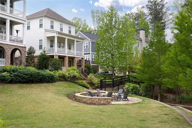 view of yard featuring a patio and a fire pit