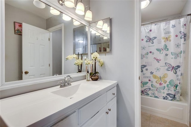 full bath featuring shower / tub combo with curtain, vanity, and tile patterned flooring