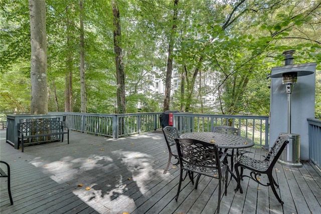 wooden deck featuring outdoor dining area