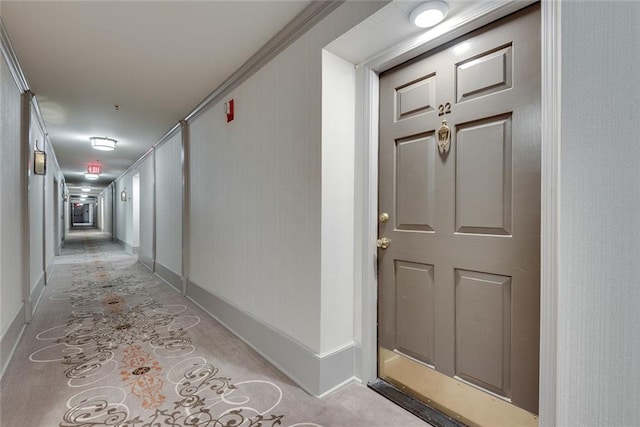 hall featuring baseboards