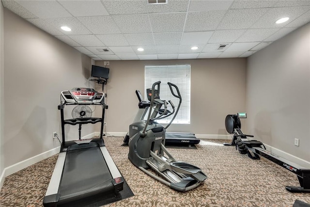 workout room with carpet flooring, baseboards, a drop ceiling, and recessed lighting