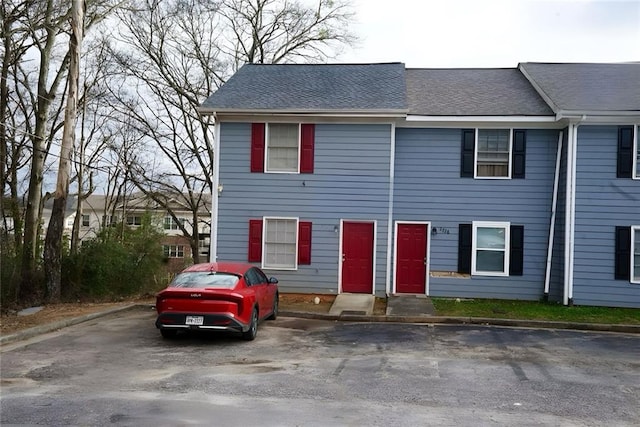 2726 Evans Mill Dr, Lithonia, GA 30058 - view of property featuring a shingled roof