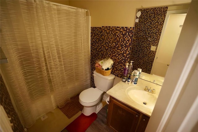 2726 Evans Mill Dr, Lithonia, GA 30058 - bathroom featuring tile walls, toilet, vanity, a shower with shower curtain, and wood finished floors