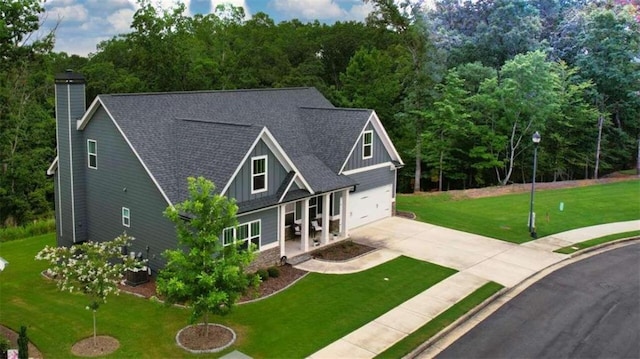 view of front of home featuring a garage and a front lawn