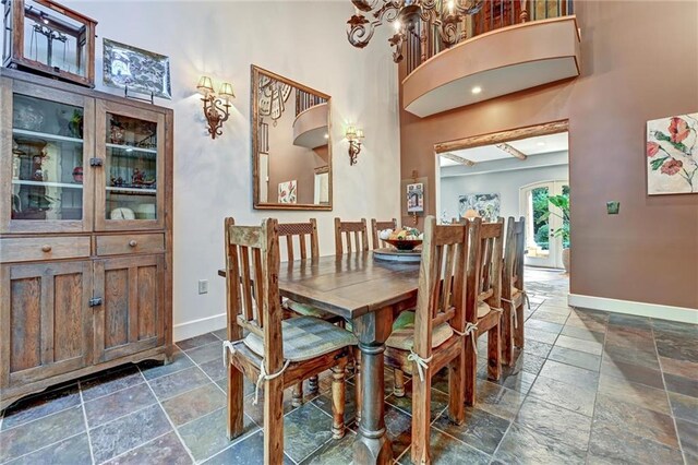 dining area with a high ceiling