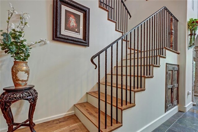 staircase featuring hardwood / wood-style flooring