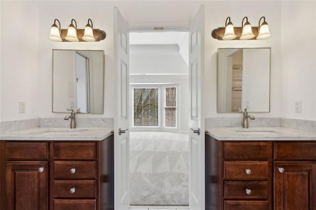 full bathroom with two vanities and a sink