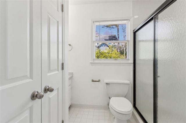 full bathroom with tile patterned flooring, toilet, baseboards, and a stall shower