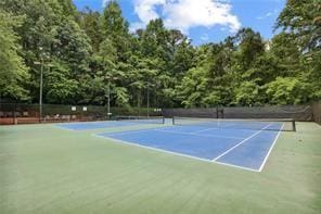 view of tennis court featuring community basketball court