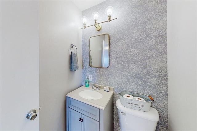 bathroom with vanity and toilet