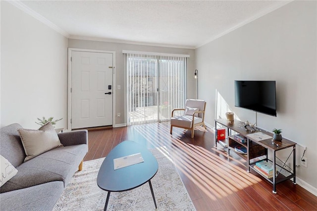 living room with hardwood / wood-style flooring and ornamental molding