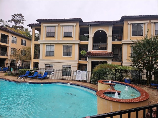 view of swimming pool featuring pool water feature