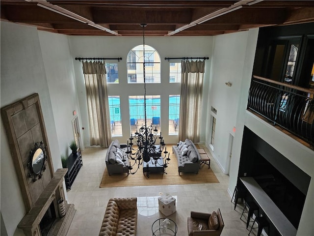 living room featuring a chandelier and a high ceiling