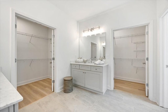 bathroom with hardwood / wood-style flooring and vanity