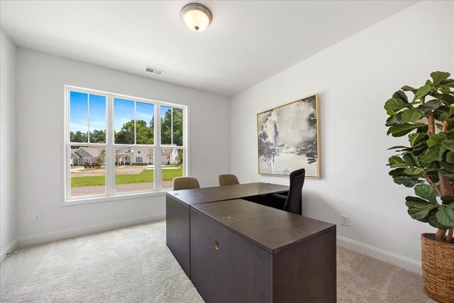 office space featuring light colored carpet