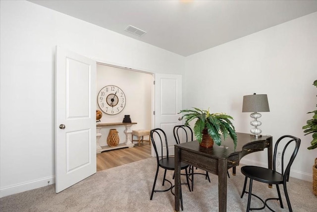 view of carpeted dining space