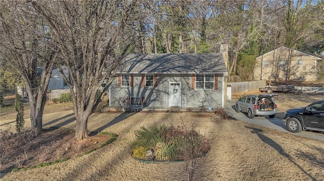 view of front of property with a chimney