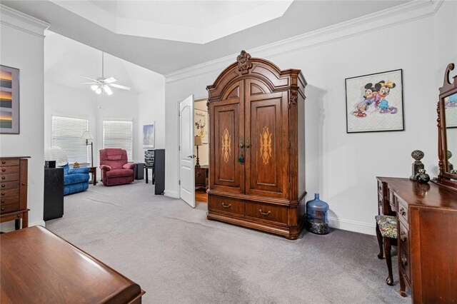 living area with light carpet, baseboards, ceiling fan, and crown molding