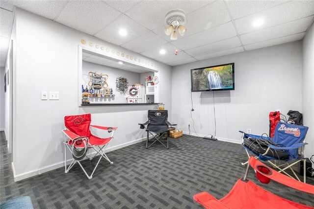 recreation room with carpet flooring, baseboards, a drop ceiling, and recessed lighting