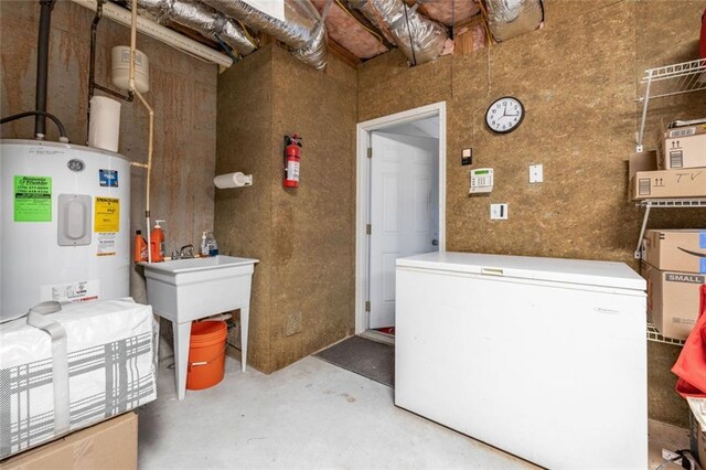 utility room with electric water heater