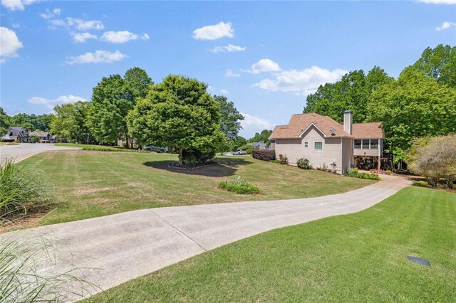 view of community featuring a lawn