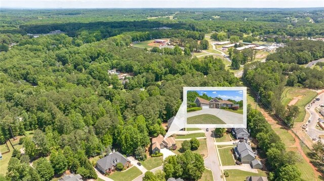 aerial perspective of suburban area with a heavily wooded area