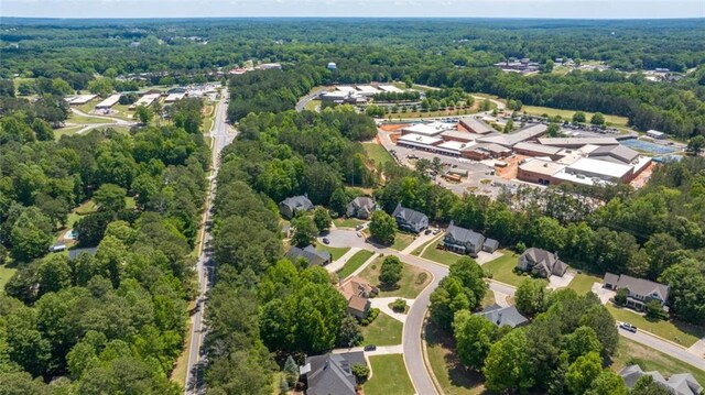aerial overview of property's location with a forest