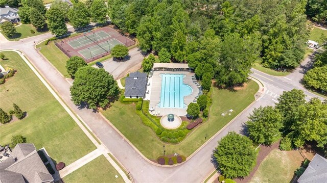 view of property location featuring a pool