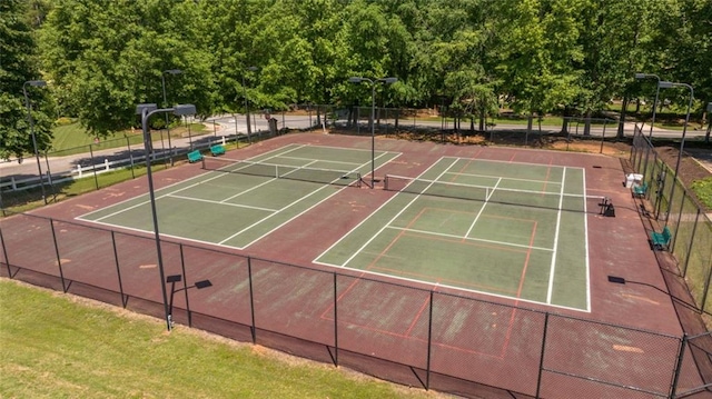 view of tennis court with fence