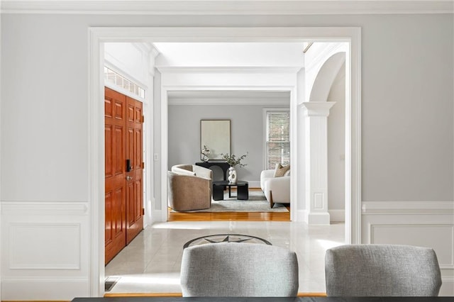 130 Robin Rd, Marietta, GA 30067 - tiled entrance foyer with crown molding, ornate columns, and arched walkways