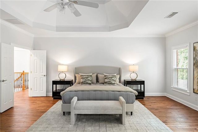130 Robin Rd, Marietta, GA 30067 - bedroom with hardwood / wood-style flooring, baseboards, ornamental molding, a tray ceiling, and ceiling fan