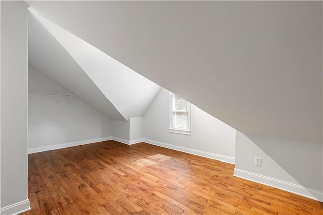 130 Robin Rd, Marietta, GA 30067 - additional living space featuring light wood-style floors, vaulted ceiling, and baseboards