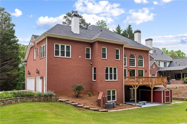 130 Robin Rd, Marietta, GA 30067 - back of property with a chimney, brick siding, a yard, a patio, and a garage