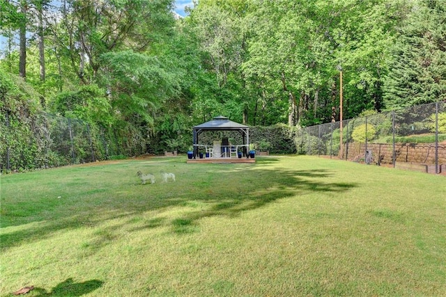 view of yard featuring a gazebo and fence