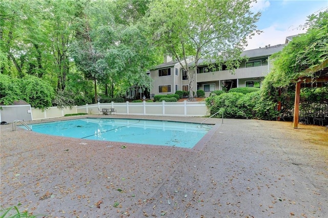 view of pool featuring a fenced in pool and fence