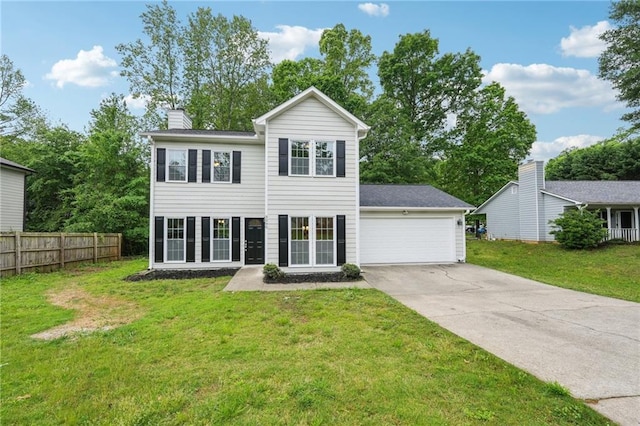 colonial-style house featuring driveway, a chimney, fence, an attached garage, and a front yard