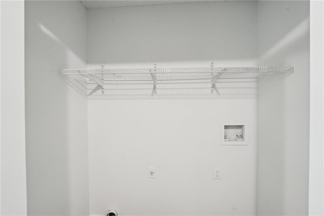 clothes washing area featuring electric dryer hookup, laundry area, and washer hookup