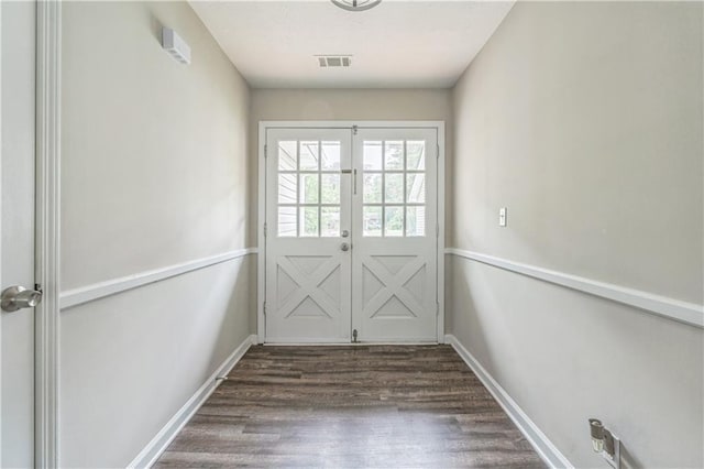 doorway to outside with wood finished floors, french doors, and baseboards