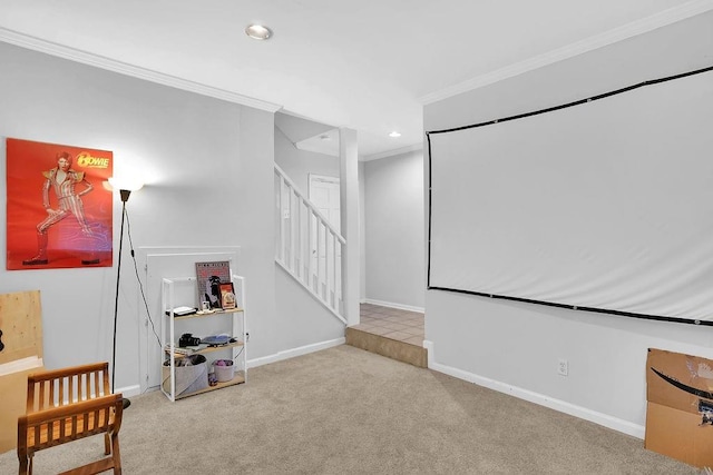 carpeted home theater with ornamental molding