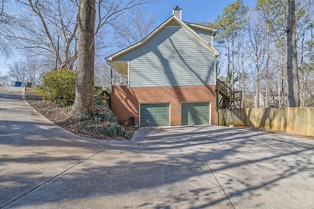 view of side of home featuring a garage