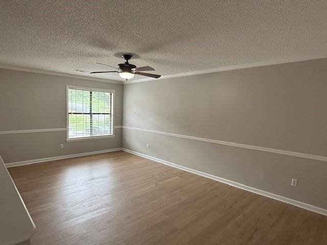 363 Mount Vernon Dr, Calhoun, GA 30701 - spare room featuring wood finished floors, a textured ceiling, ornamental molding, ceiling fan, and baseboards