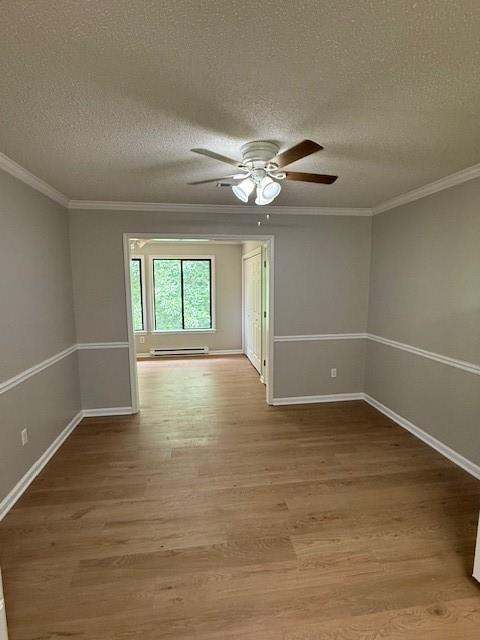 363 Mount Vernon Dr, Calhoun, GA 30701 - empty room with crown molding, light wood-style floors, a textured ceiling, a ceiling fan, and baseboards